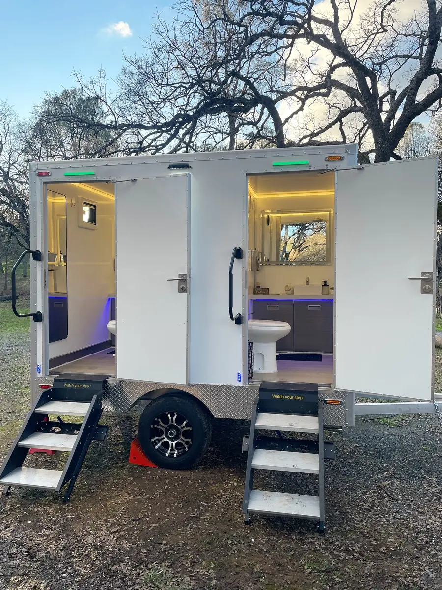 Two-stall luxury restroom trailer with lights on