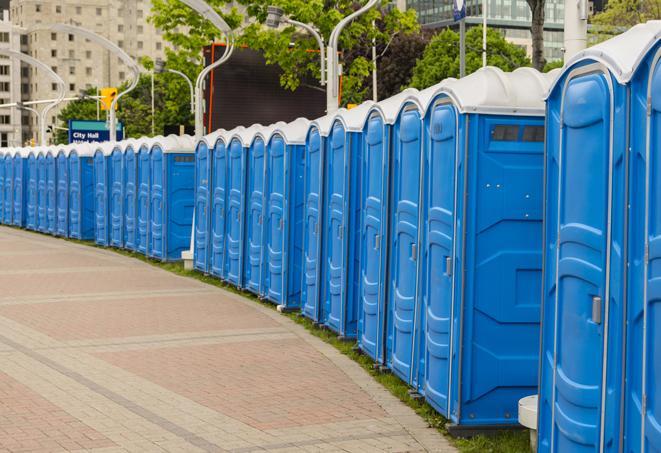 a row of portable restrooms at a fairground, offering visitors a clean and hassle-free experience in troy